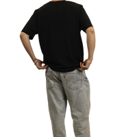 T-shirt nera unisex con stampa LED-style di pin-up su sfondo scuro vista dal retro.